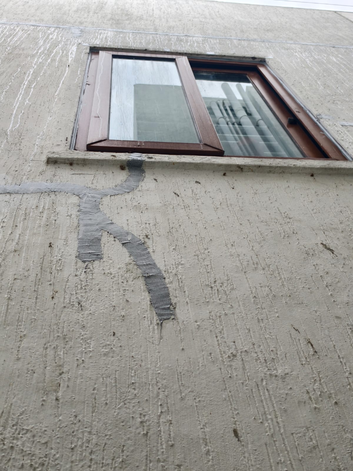 Exterior wall sealed after PU sealant waterproofing at Kannamangala